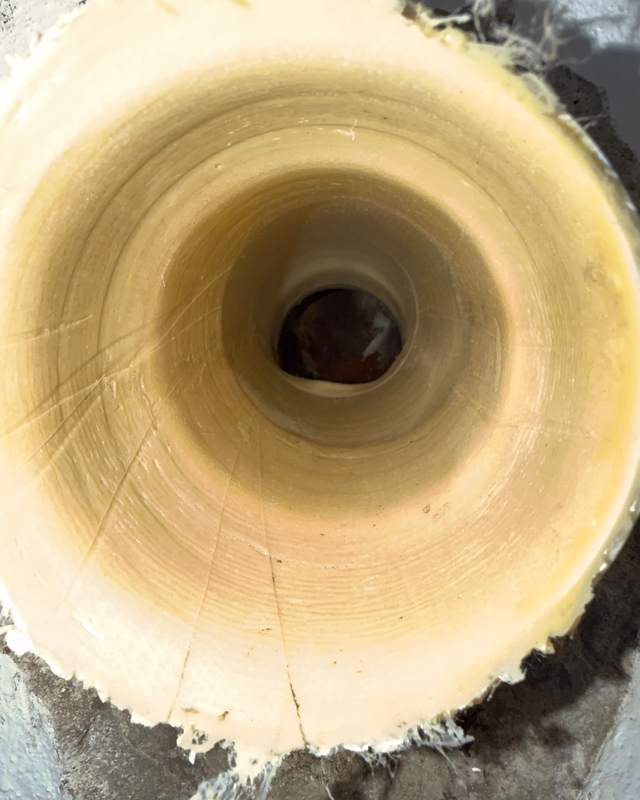 Looking along the inside of a relined pipe