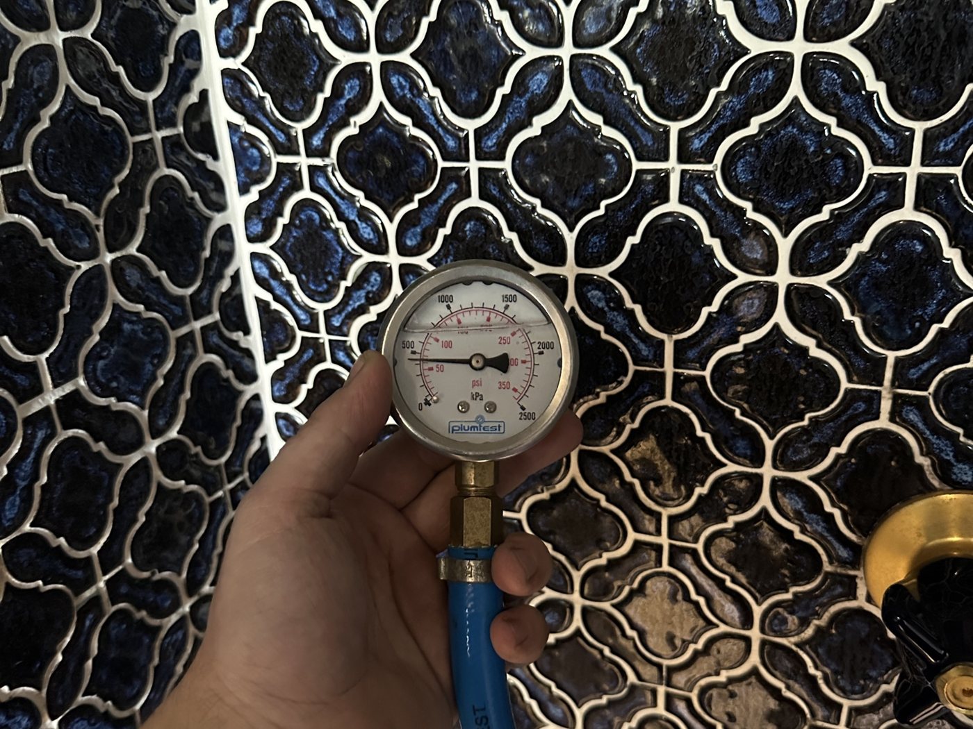 Mr Splash plumber pressure-testing a repaired water line to check it holds
