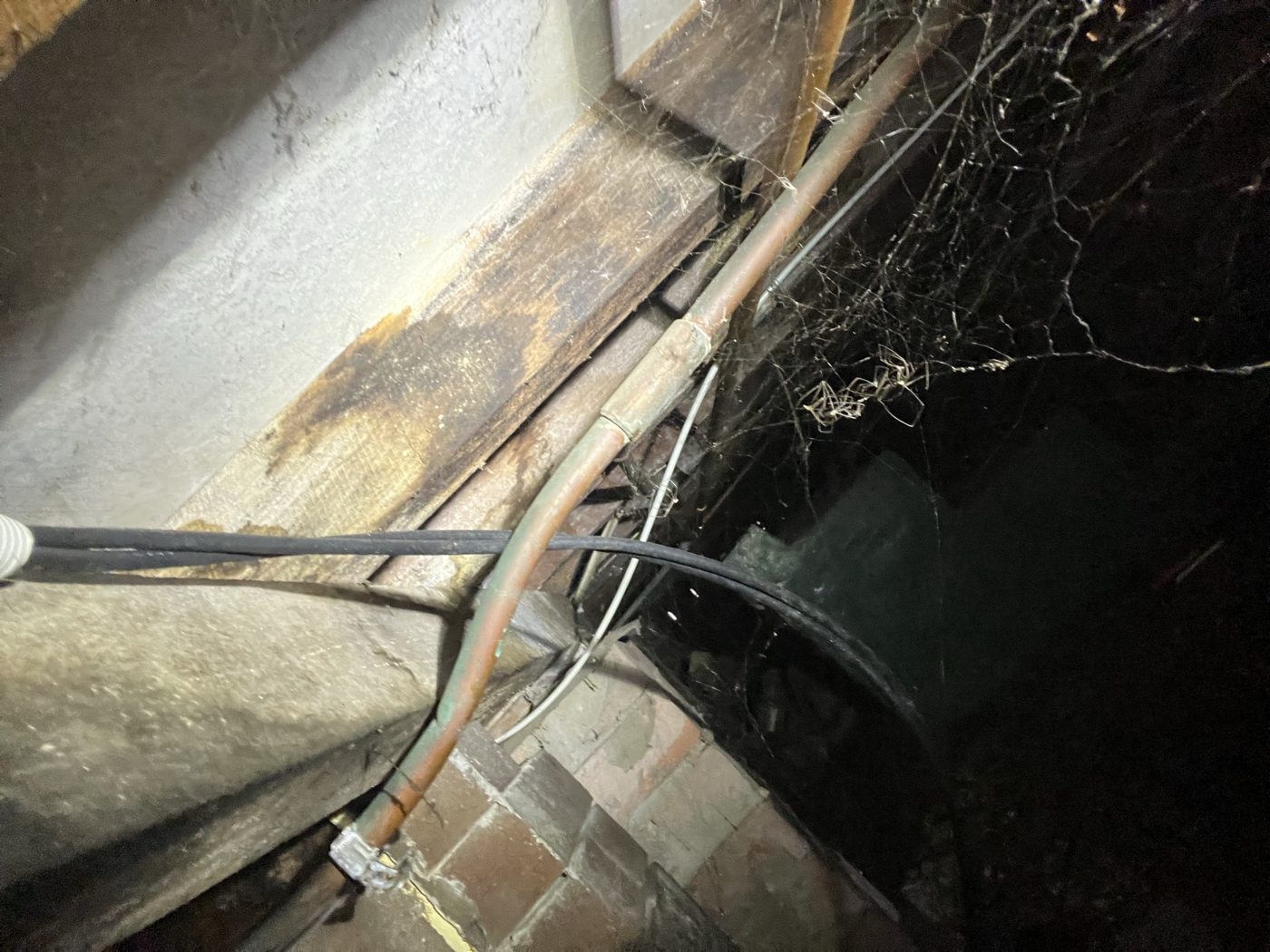 Water pipework in the subfloor of a home in Leichhardt during a burst pipe repair