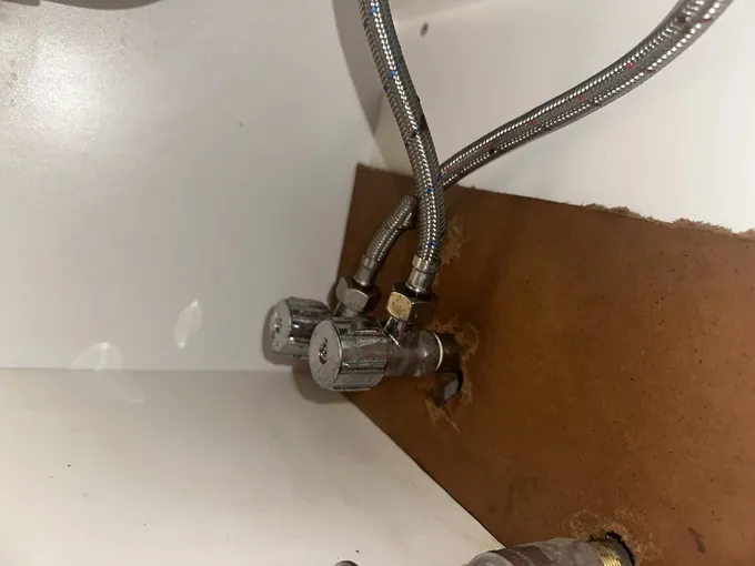 Isolation valves and braided hoses under a sink