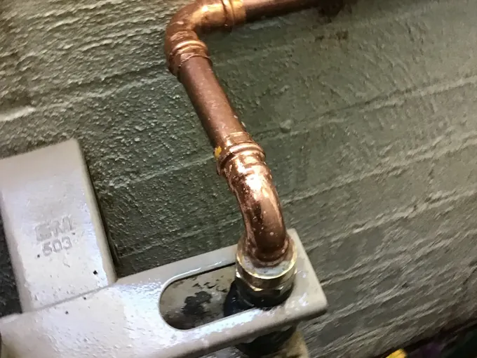 New copper gas pipe fitted at a gas meter