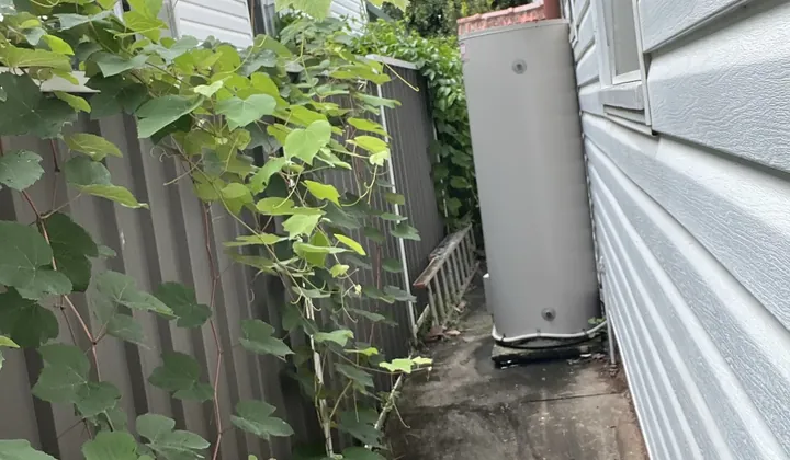 Electric storage hot water system at the end of a narrow side path