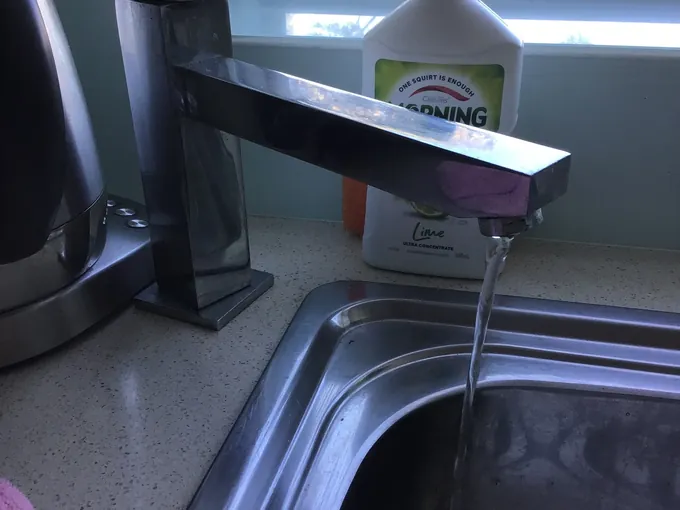 Water running from the mixer into a kitchen sink in Centennial Park