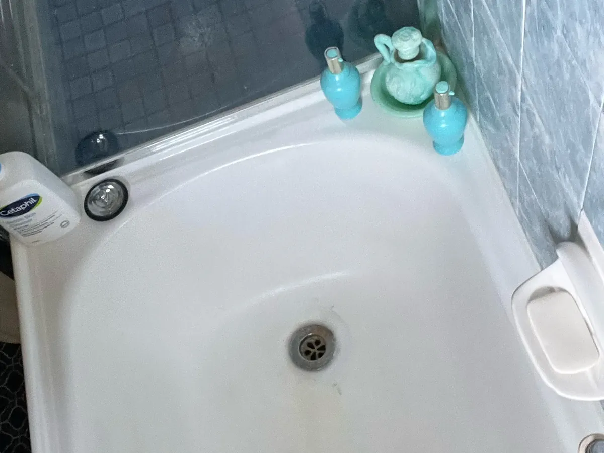 Bath with the waste and overflow in a tiled bathroom in Seven Hills