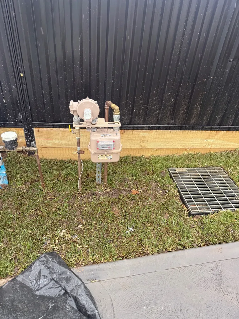 Gas meter and regulator on a post in a back yard during gas leak detection by Mr Splash in Carramar