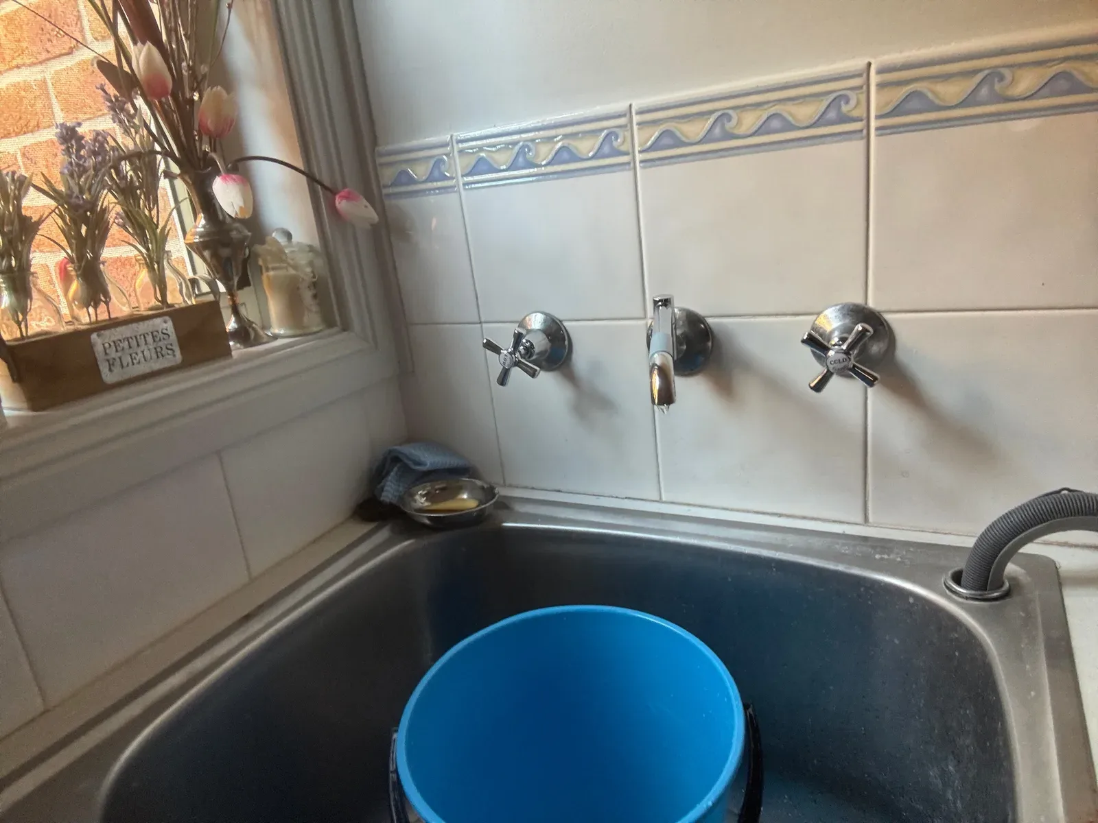 Mr Splash plumber stripping a leaking tap to find the worn part