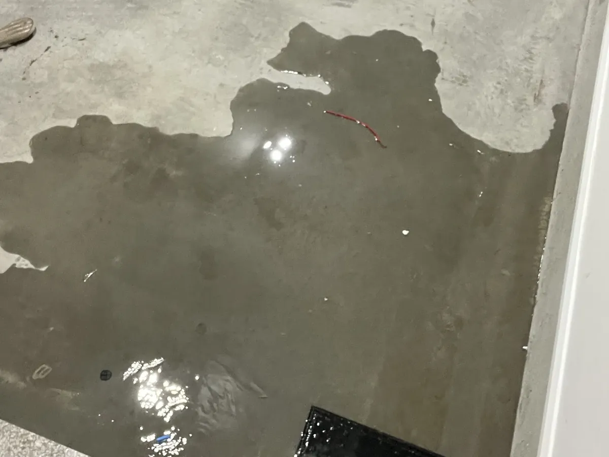 Water spread across a concrete floor in Austral