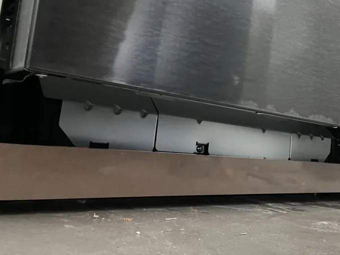 Base of a new stainless dishwasher set into its space above the kickboard in Bexley