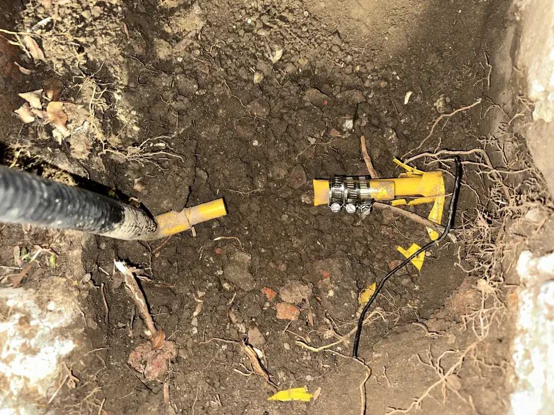 Gas service line repaired with new couplings in an excavation on a Mr Splash gas job in Earlwood