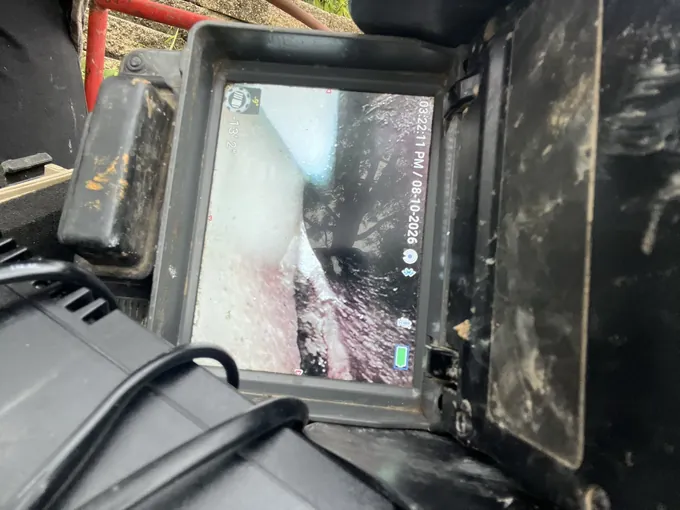 The jet spraying inside a drain pipe as it clears it, seen on camera in Oatley