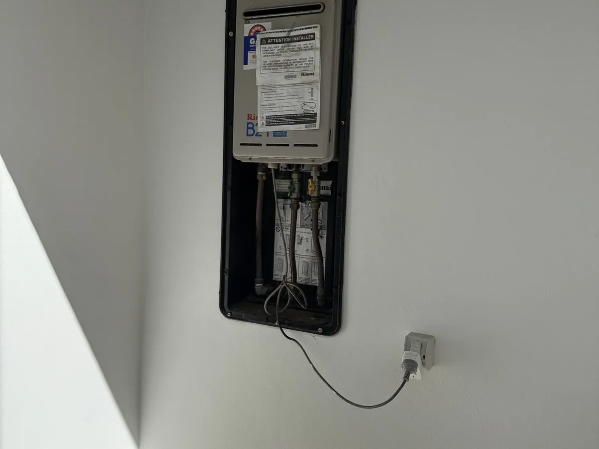 Continuous flow hot water unit set into a recess box on an internal wall in Vaucluse