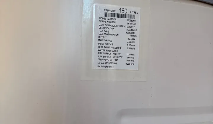 Data plate on a gas storage hot water system showing a 160 litre capacity
