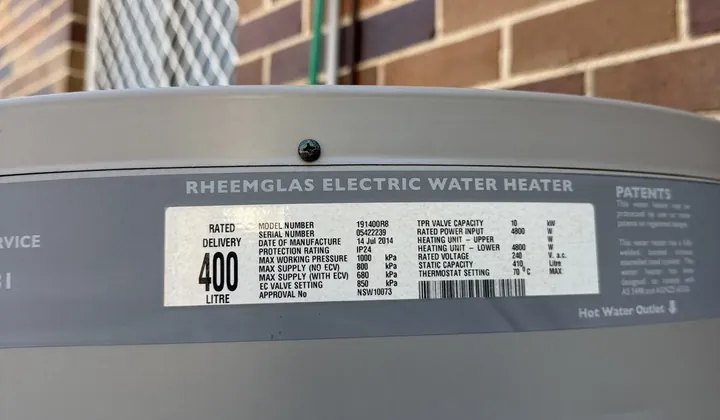 Data plate on a Rheemglas electric water heater showing 400 litre rated delivery