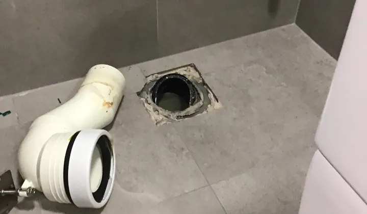 Toilet removed to show the pan connector and floor waste in Northmead