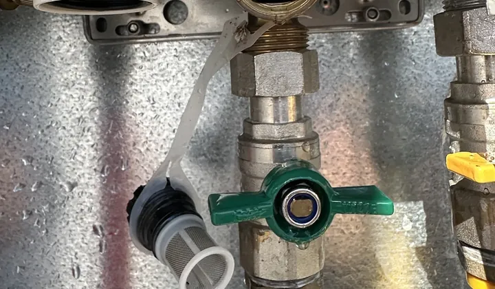 Water inlet filter taken out beside the green cold water valve under a gas hot water unit in Spring Farm
