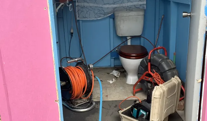 Jetter hose reel and drain camera set up at an outdoor toilet in Villawood