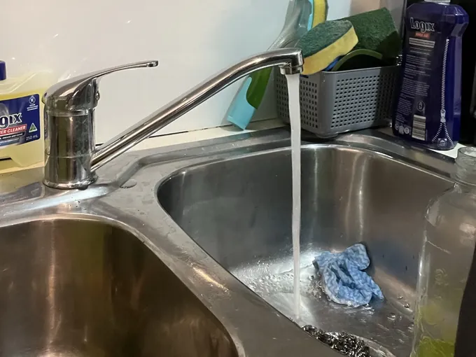 Kitchen mixer run into the sink to check the repair in Asquith