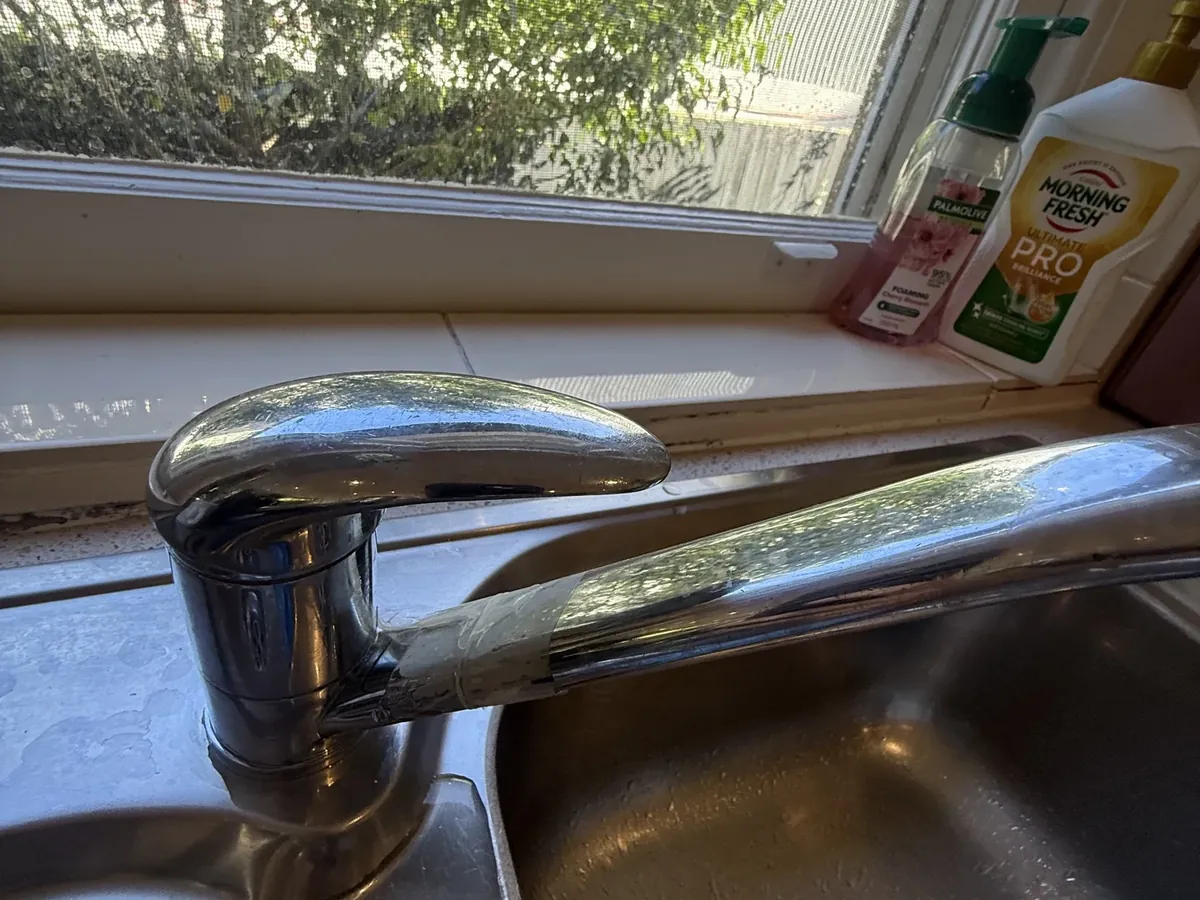 Old kitchen mixer tap with tape wrapped around the spout in Rose Bay