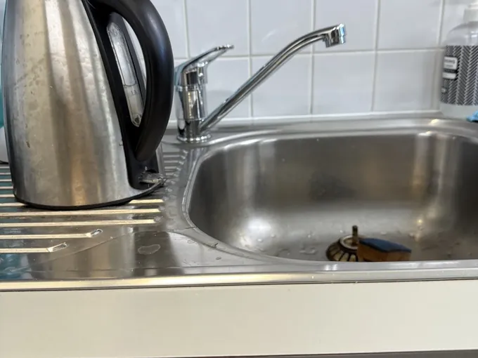 Kitchen sink mixer checked for hot water in a Bella Vista kitchen