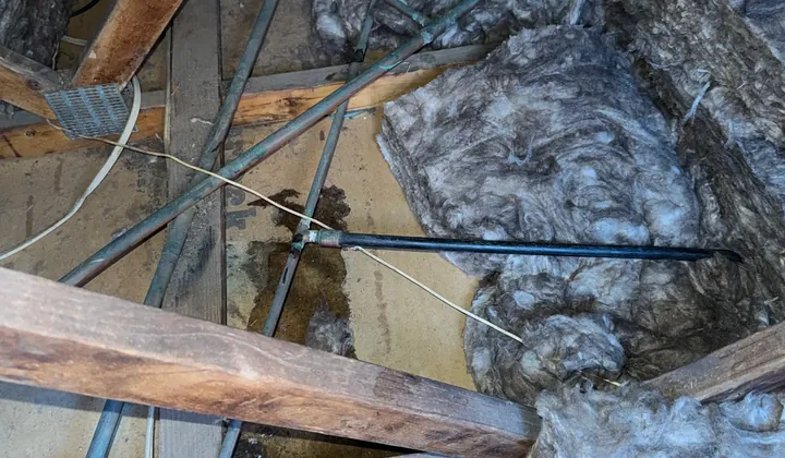 Copper water pipes and water stains in a roof space in Casula