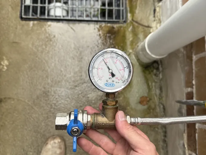 Pressure gauge fitted to a water line on a Mr Splash job