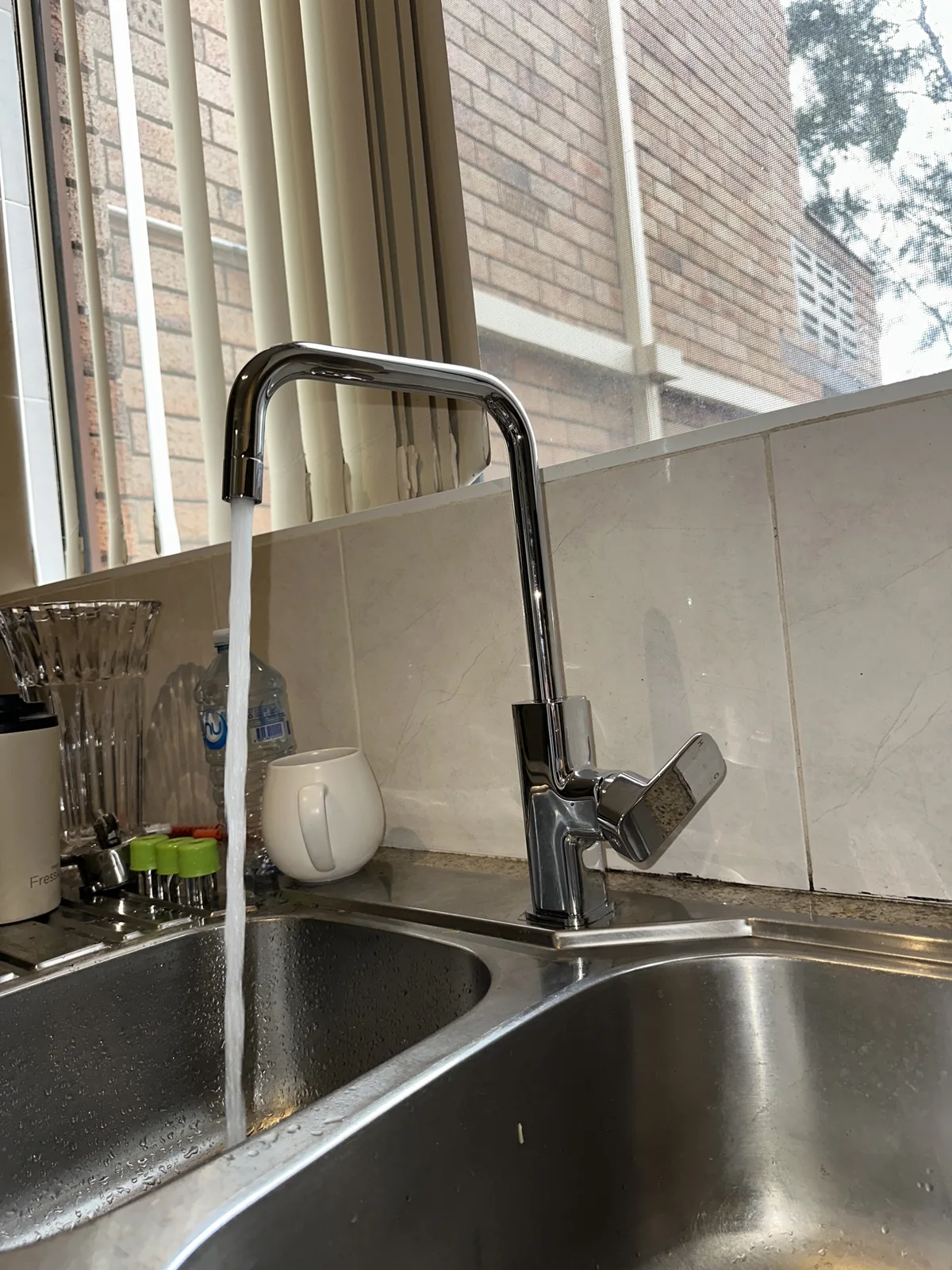 Kitchen mixer running again after a burst under-sink hose was replaced on a Mr Splash emergency job in Mortdale