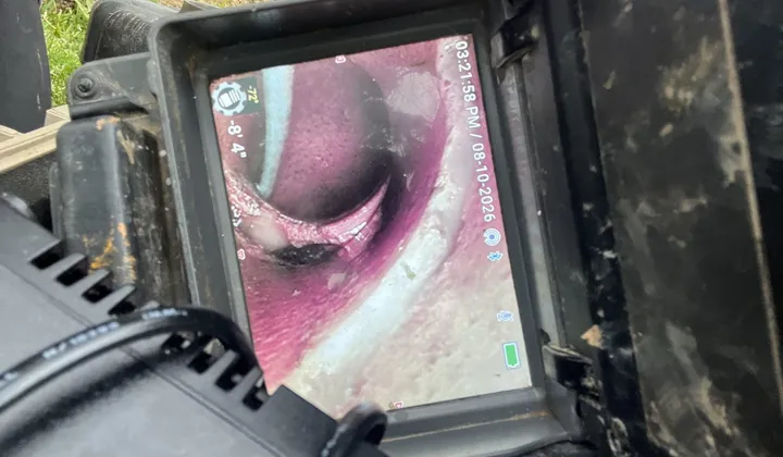 Camera monitor with the inside of the pipe on screen during the inspection in Oatley