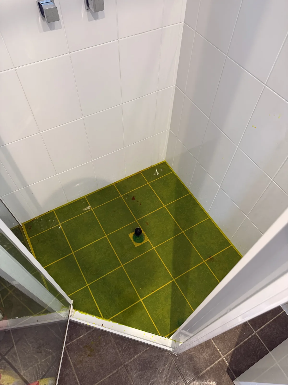 Shower recess after the leaking bath waste above the ceiling was repaired on a Mr Splash job in Pendle Hill