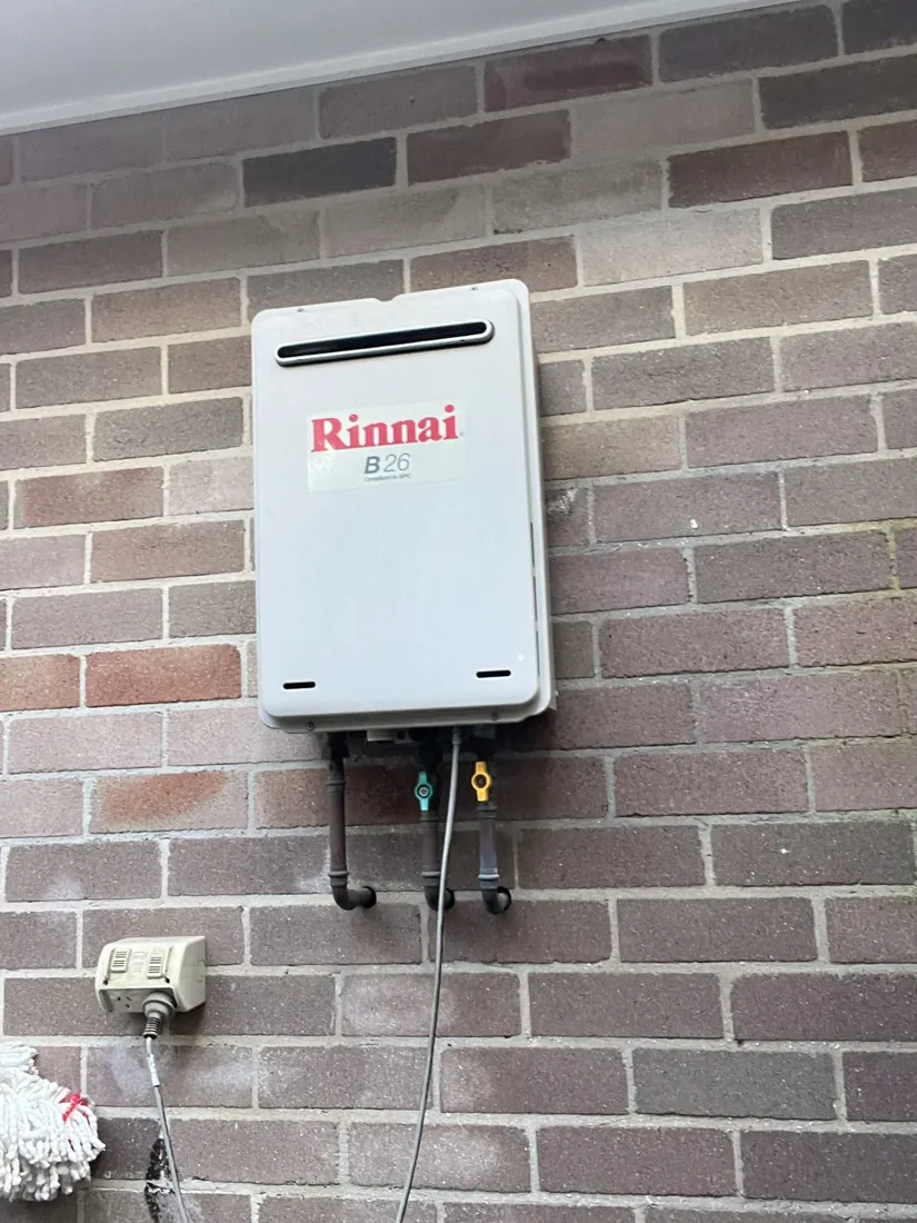 External continuous flow gas hot water unit and its gas isolation valve on a Mr Splash gas job in Petersham