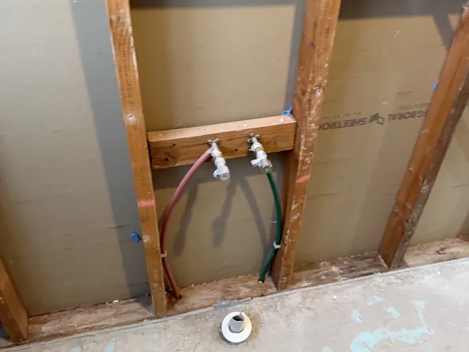 Bathroom stripped to the wall frames with new water lines run and the floor waste set, Padstow