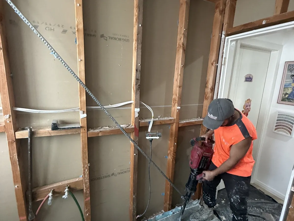Mr Splash plumber demolishing an old bathroom down to the wall frames in Padstow