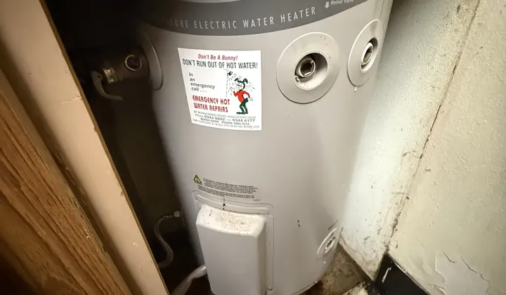 Top of a Rheem mains pressure electric water heater fitted in a cupboard in Rose Bay