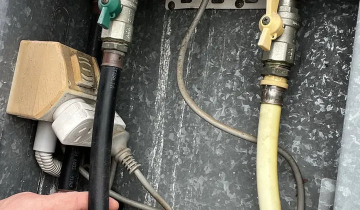 Hot, cold and gas connections underneath a continuous flow gas hot water unit