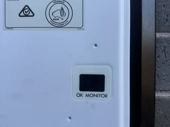 Status monitor on the front panel of a continuous flow gas unit in Denham Court