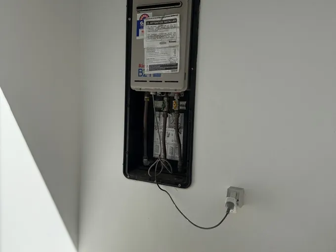 Continuous flow hot water unit set into a recess box on an internal wall in Vaucluse