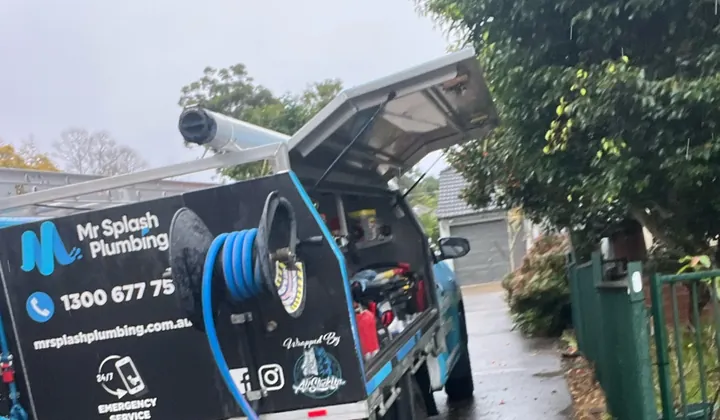 Mr Splash ute with its canopy open and the blue jetter hose run off the reel in Rydalmere