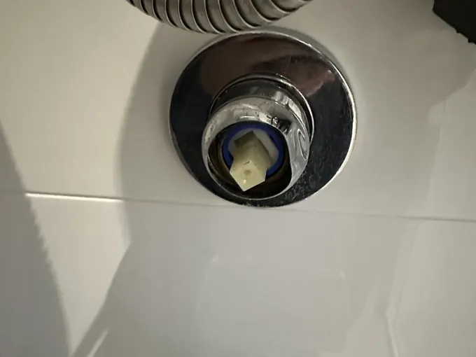 Shower mixer opened up with the cartridge showing in Campsie