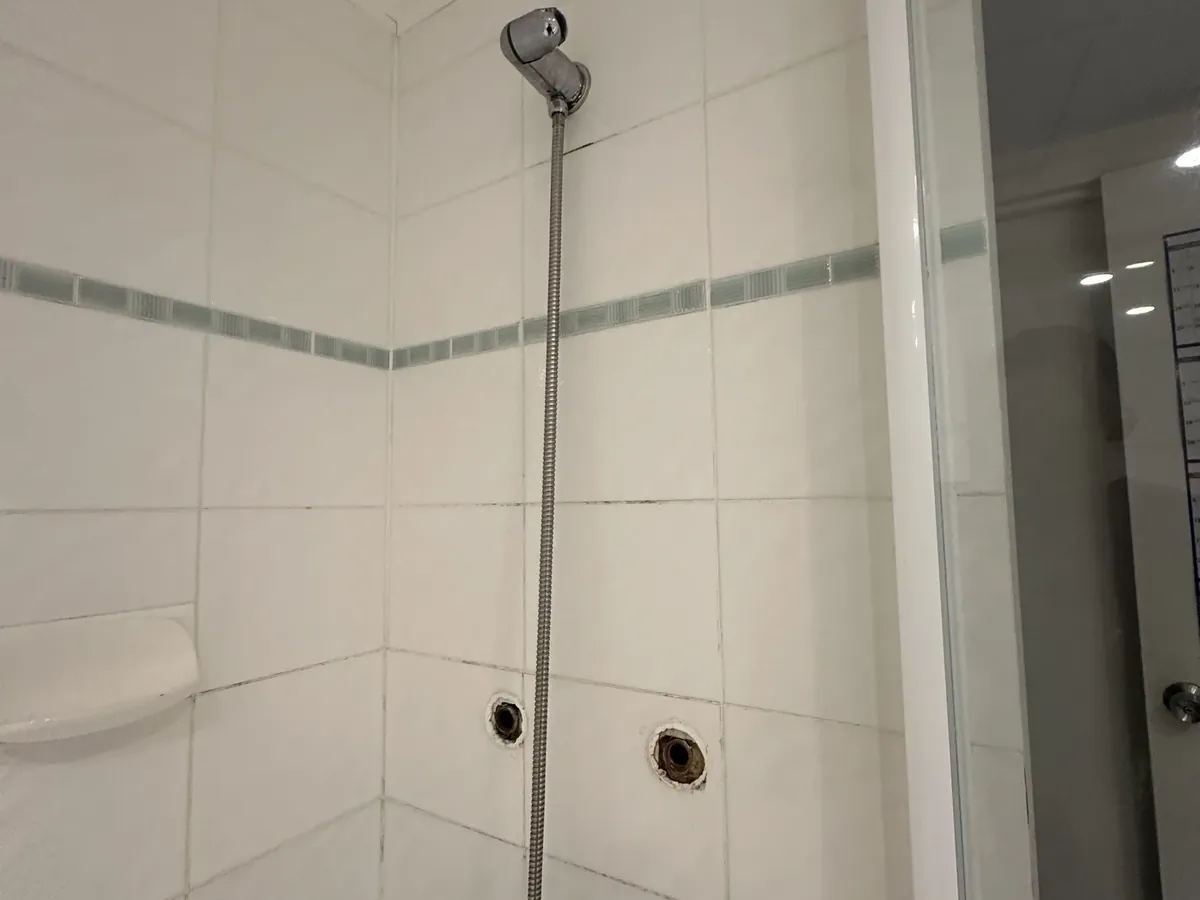 Shower recess with the mixer taken off the tiled wall in Surry Hills