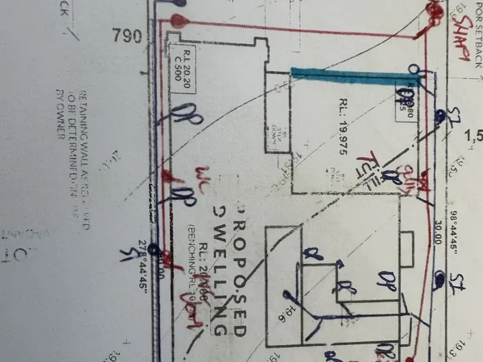 Site drainage plan marked up with storm water and downpipe runs for a new house in Wilton