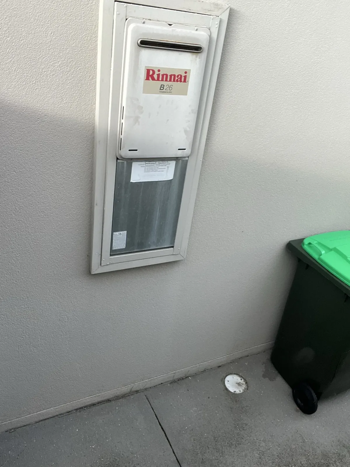 Thermann Hot Water Sydney - Continuous flow gas hot water unit fitted in a recess box on a rendered wall in Kellyville