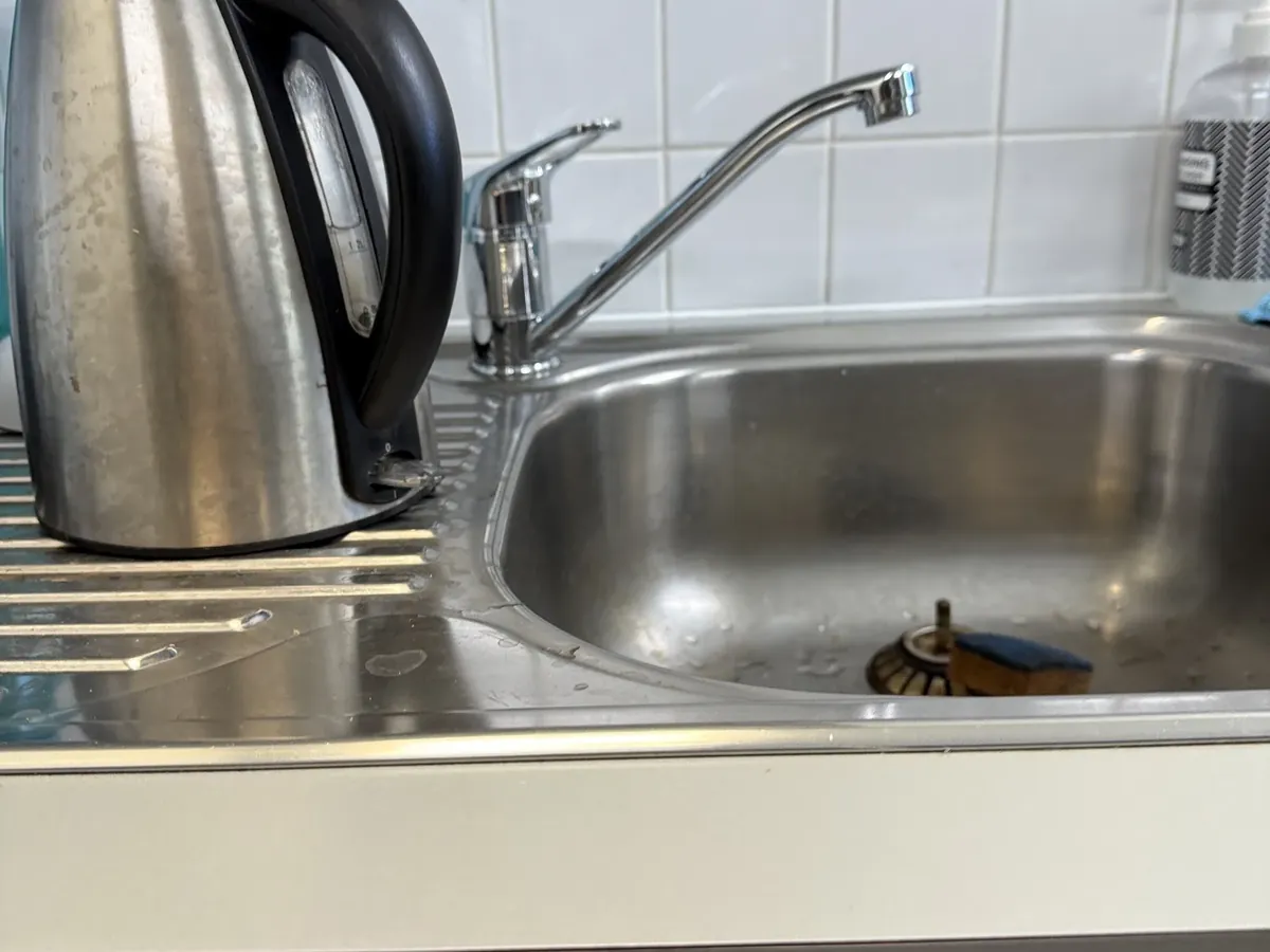 Kitchen sink mixer checked for hot water in a Bella Vista kitchen