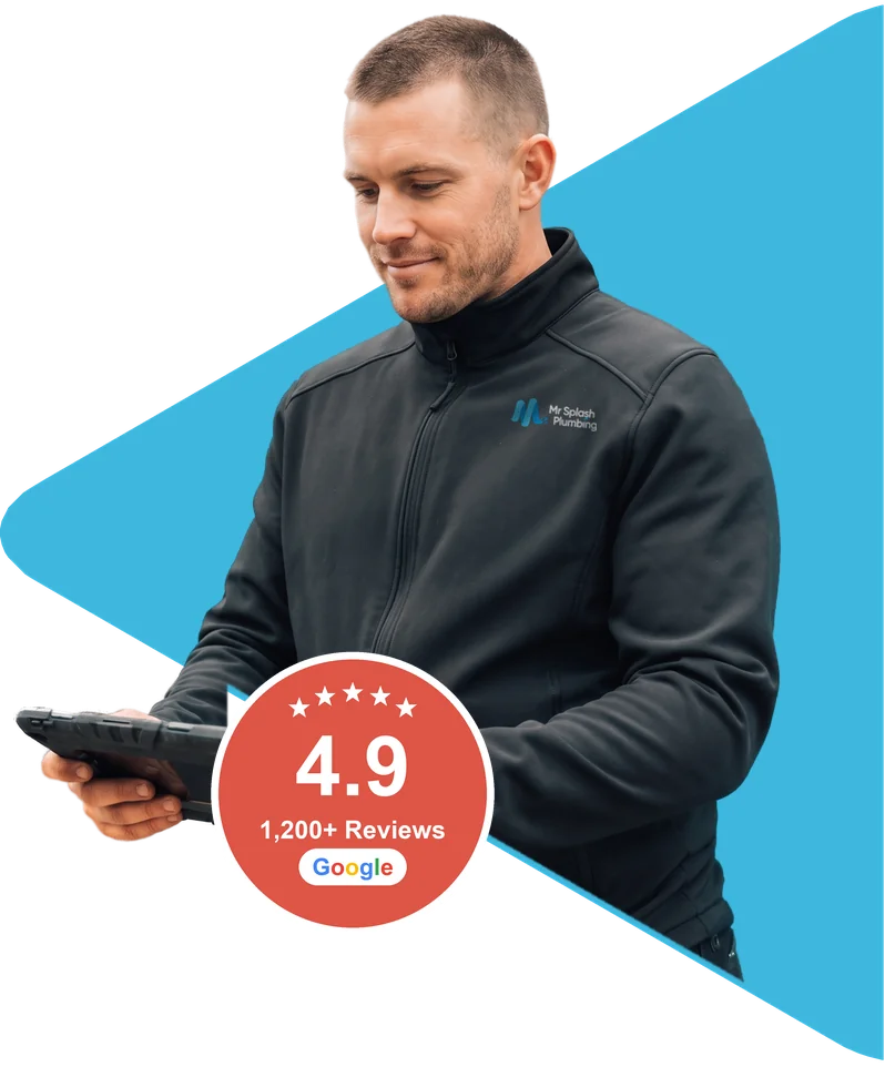 Plumber in a Mr Splash Plumbing jacket checking a tablet, beside the 4.9 star Google reviews badge