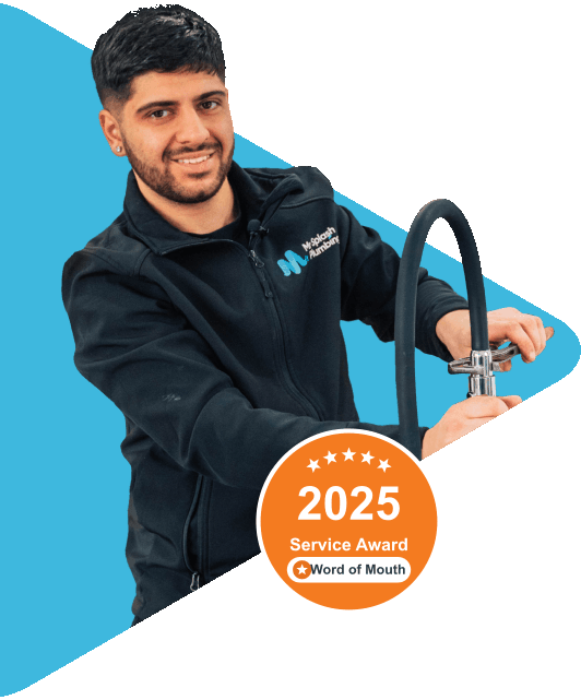 Mr Splash Plumbing team member fixing sink