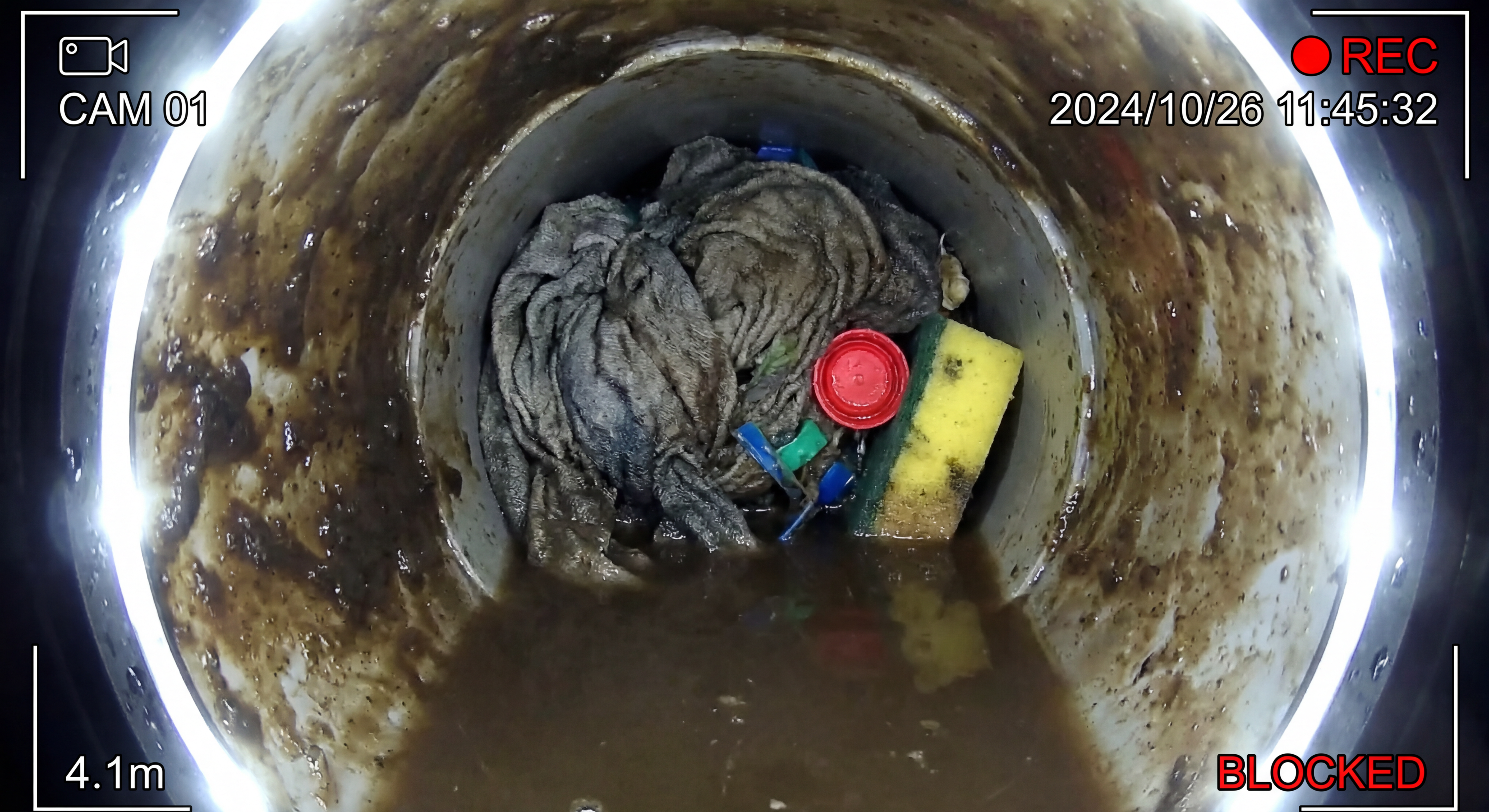 CCTV camera showing foreign objects lodged in drain pipe