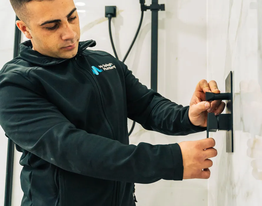 Mr Splash plumber fitting a matte black shower mixer